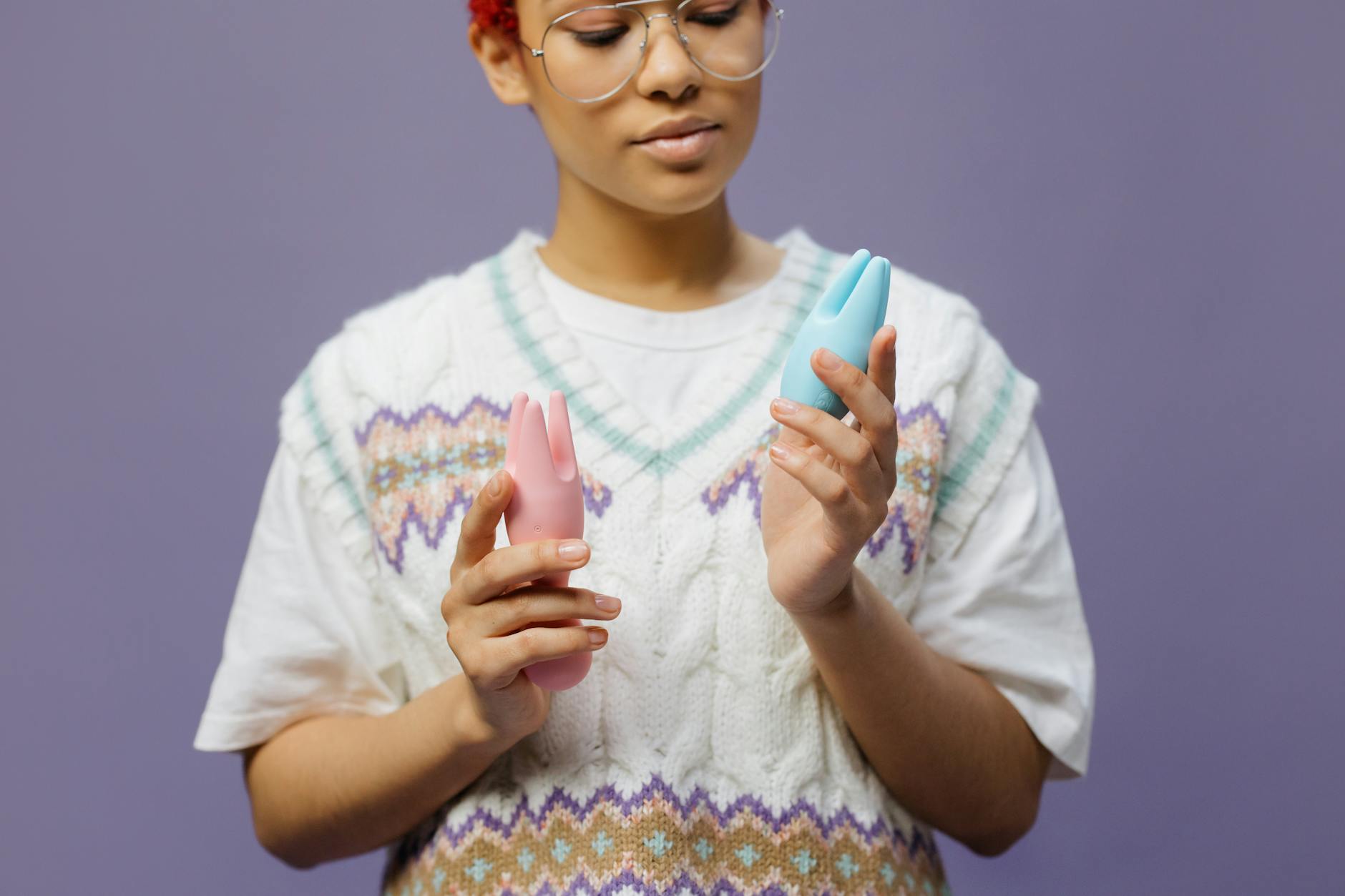 Woman reconnecting with her body and sensuality after recovery from depression, holding a blue vibrator with quiet intention